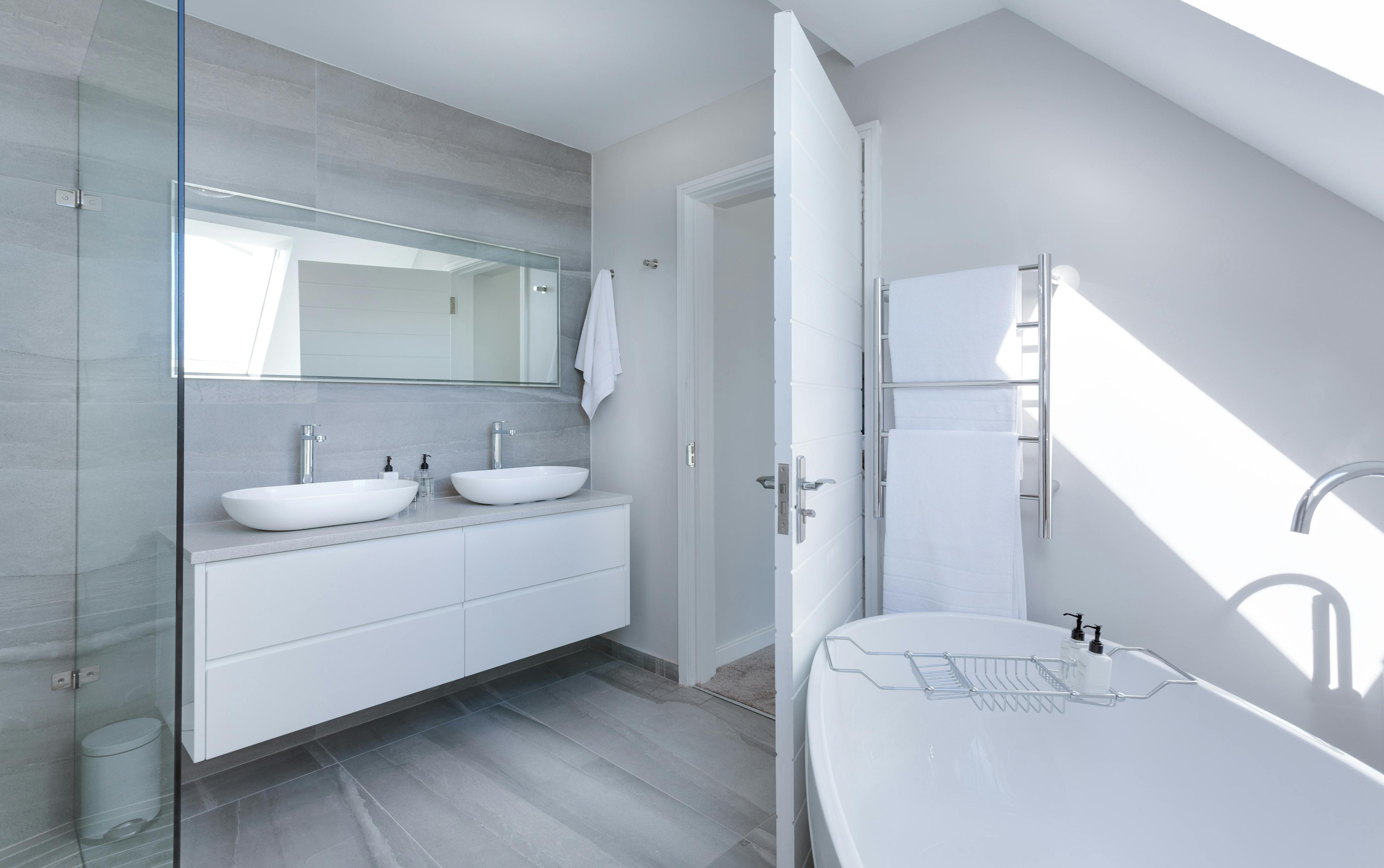 Contemporary bathroom with floating vanity and freestanding tub
